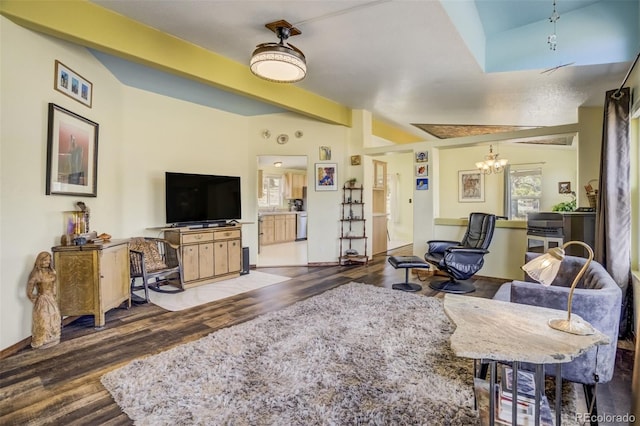 464 Hackamore Dr, Florissant, CO 80816 - living area with a notable chandelier, baseboards, and wood finished floors