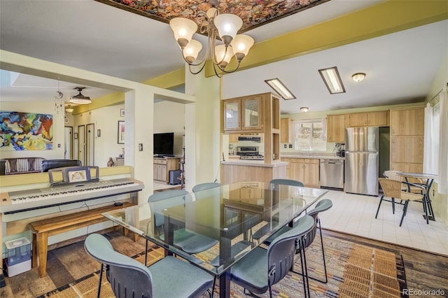 464 Hackamore Dr, Florissant, CO 80816 - dining area with an inviting chandelier and light wood-style flooring