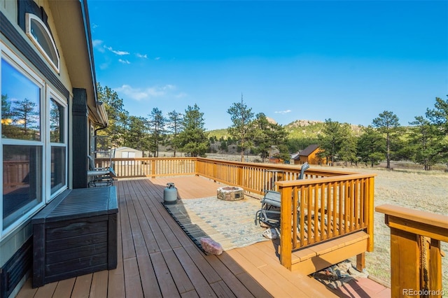 464 Hackamore Dr, Florissant, CO 80816 - wooden deck featuring an outbuilding and a shed