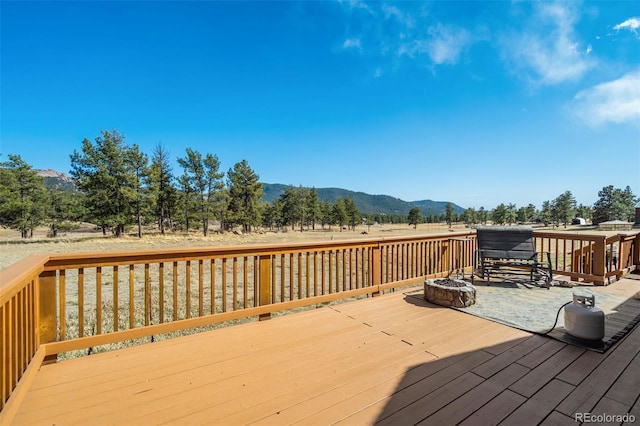 464 Hackamore Dr, Florissant, CO 80816 - deck featuring a fire pit and a mountain view