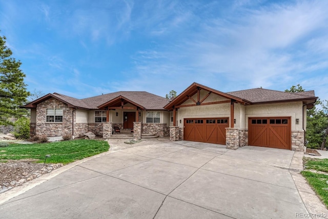 view of front of home with stone siding, a garage, concrete driveway, covered porch, and a front yard