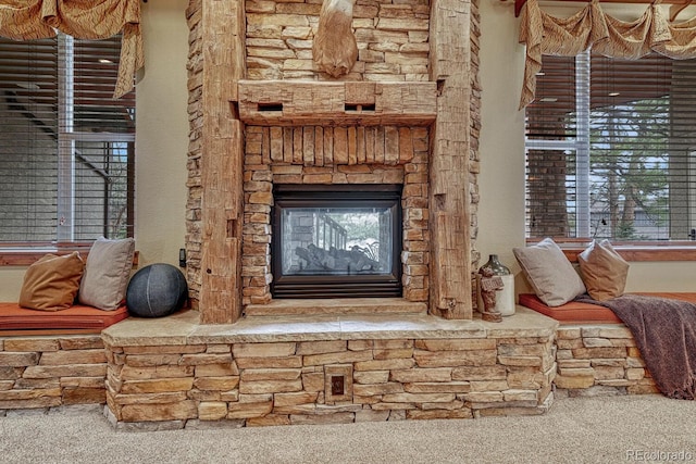carpeted living room with a fireplace