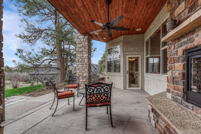 view of patio featuring ceiling fan