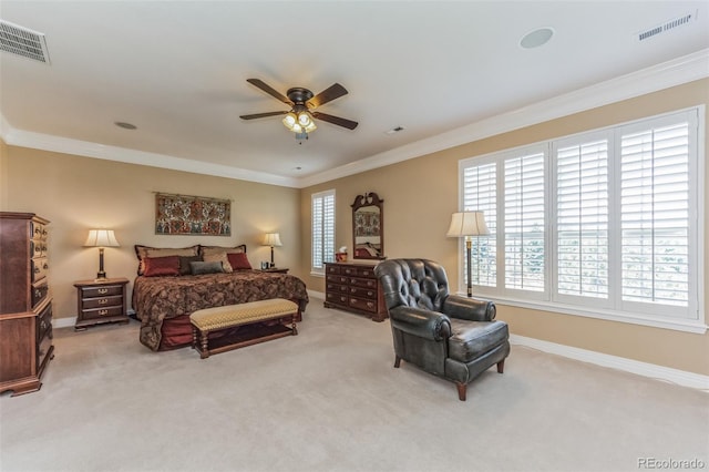 carpeted bedroom with visible vents, multiple windows, and crown molding