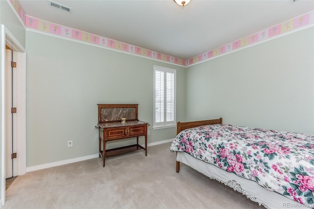 bedroom with visible vents, baseboards, and carpet flooring