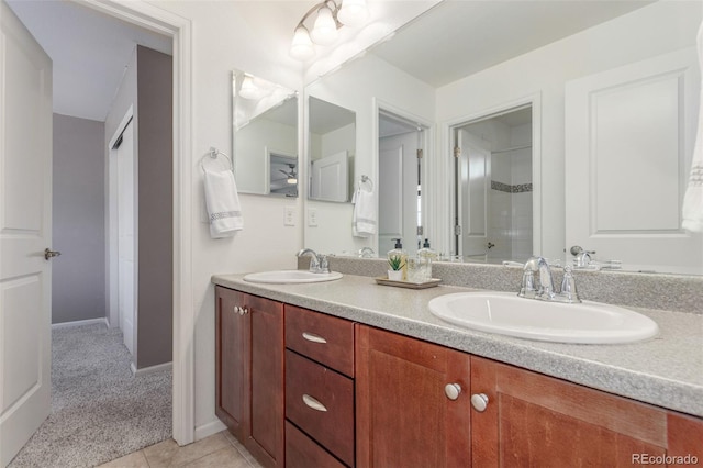 16694 Miners Way, Broomfield, CO 80023 - bathroom with double vanity, tile patterned flooring, and a shower