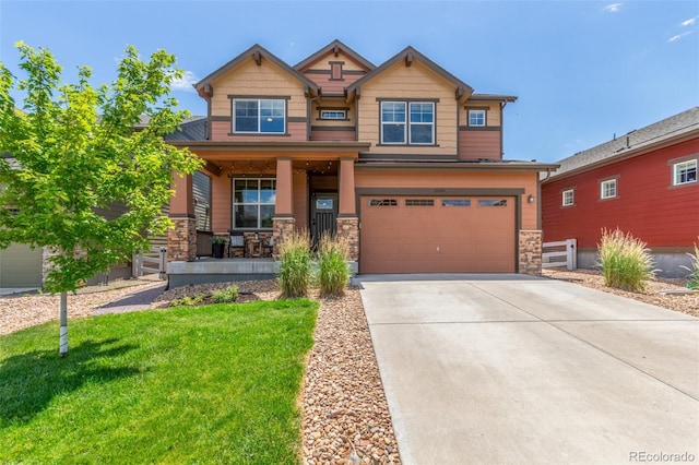 16694 Miners Way, Broomfield, CO 80023 - craftsman-style home with covered porch, stone siding, driveway, and a garage