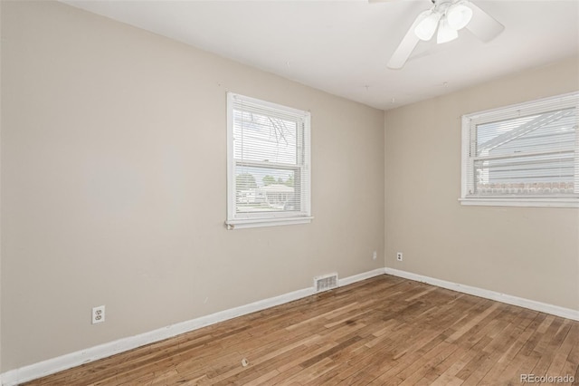 770 Havana St, Aurora, CO 80010 - spare room featuring healthy amount of natural light, wood-type flooring, baseboards, and ceiling fan