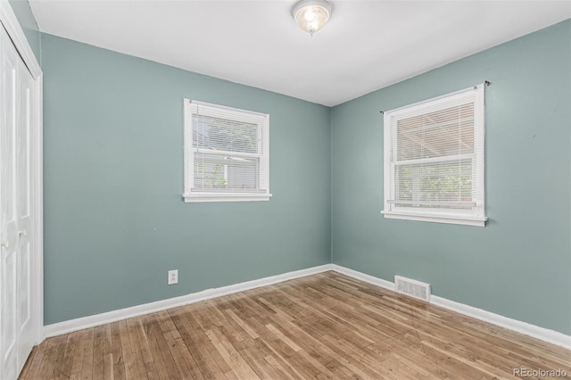 770 Havana St, Aurora, CO 80010 - unfurnished bedroom featuring a closet, wood finished floors, and baseboards