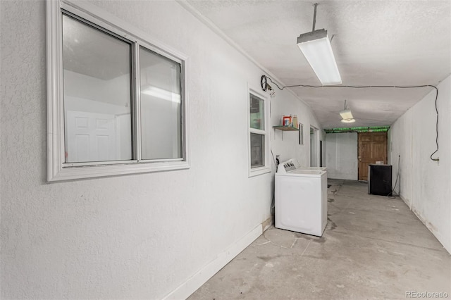770 Havana St, Aurora, CO 80010 - basement with washer / dryer and a textured wall
