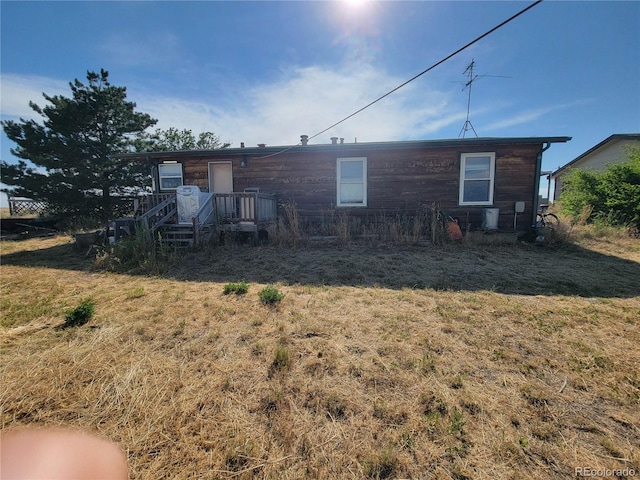 71777 E County Road 10, Byers, CO 80103 - rear view of property featuring a lawn