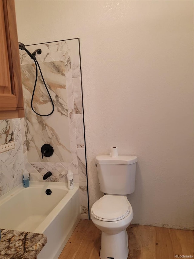 71777 E County Road 10, Byers, CO 80103 - bathroom featuring wood finished floors and bathtub / shower combination