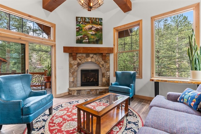 sunroom featuring beam ceiling