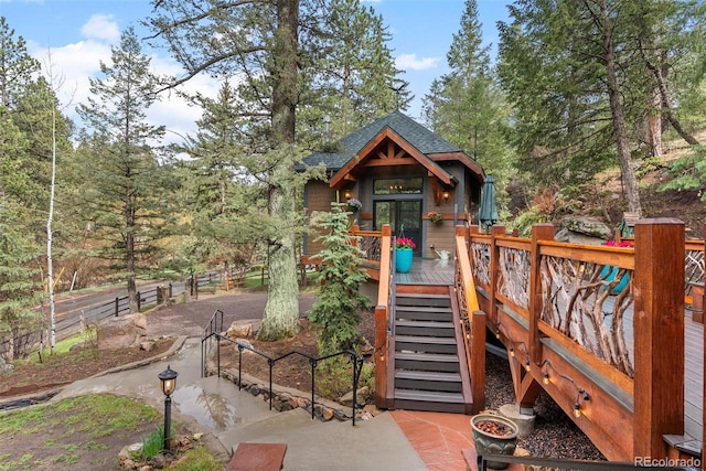 view of jungle gym featuring stairway and a deck