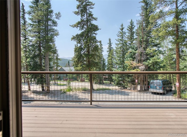 wooden deck featuring a mountain view