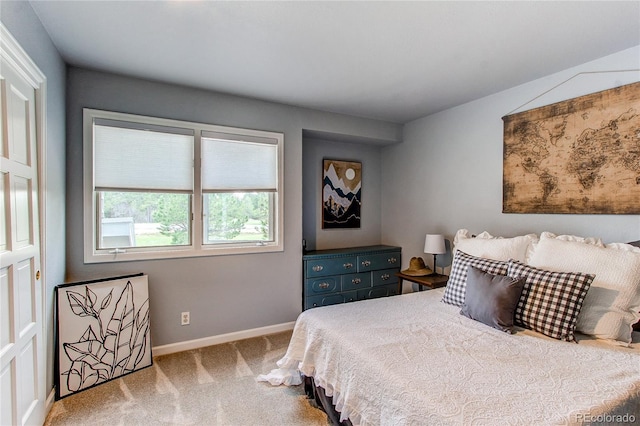 bedroom featuring light colored carpet