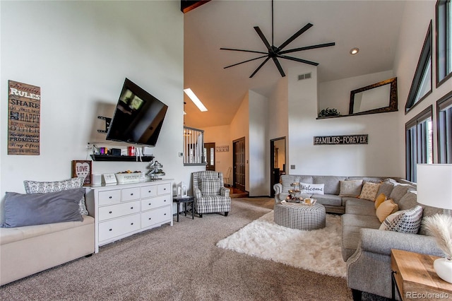 living room with high vaulted ceiling, carpet floors, visible vents, and a ceiling fan