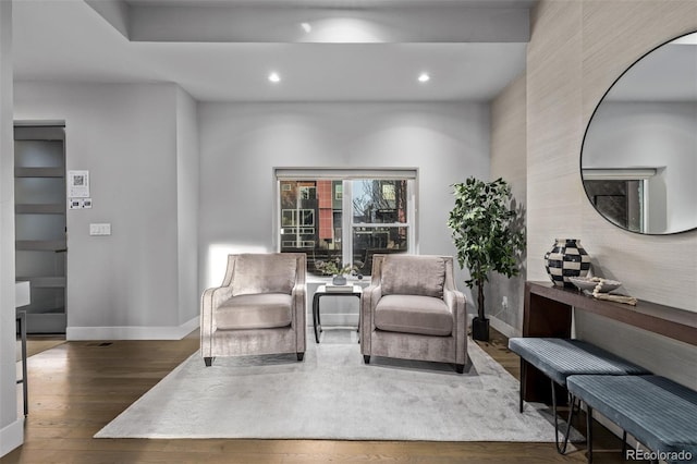 living area featuring recessed lighting, baseboards, and wood finished floors