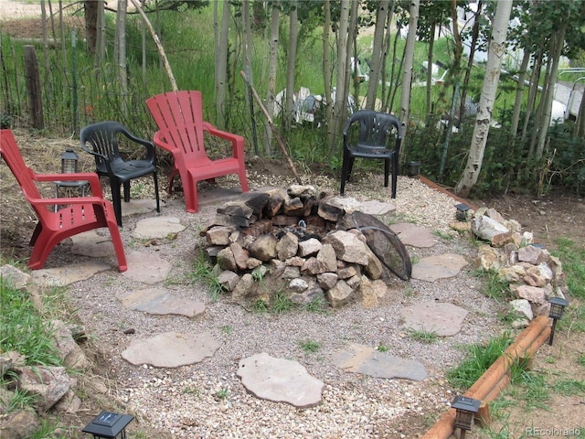 view of patio with a fire pit