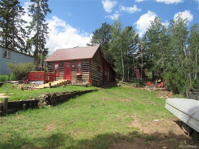 view of yard featuring an outbuilding and a wooden deck