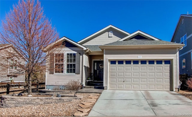 single story home featuring a garage, driveway, and a shingled roof