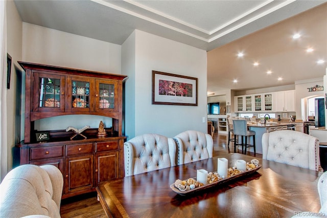 dining area with recessed lighting and dark wood-style flooring