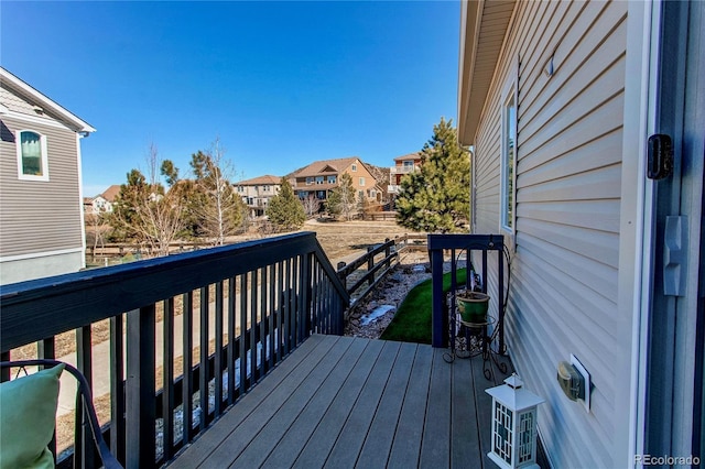 wooden deck featuring a residential view