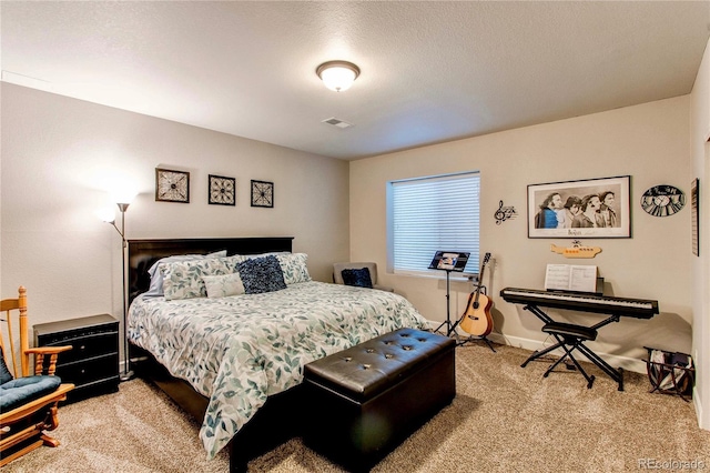 bedroom featuring visible vents, baseboards, light colored carpet, and a textured ceiling