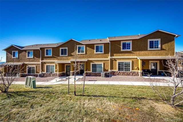7531 Red Fir Pt, Colorado Springs, CO 80908 - back of house with cooling unit, a patio area, and a yard