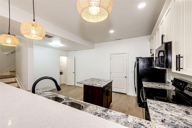 kitchen with white cabinets, dark brown cabinets, sink, and black appliances