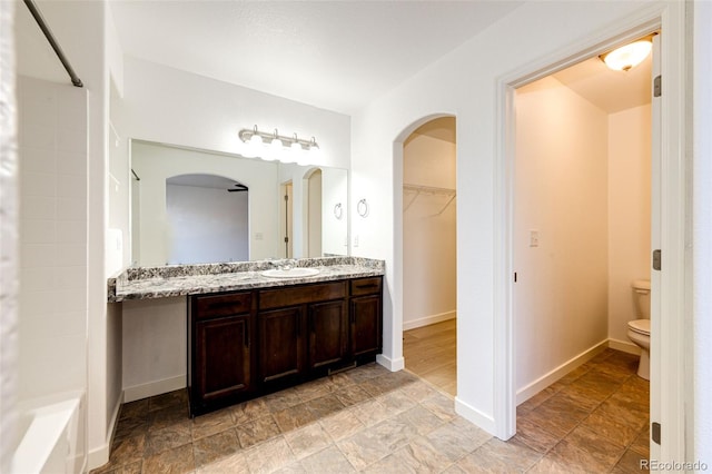 bathroom with vanity and toilet