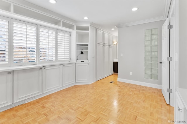 interior space featuring recessed lighting, baseboards, and ornamental molding