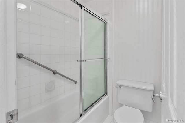full bathroom featuring combined bath / shower with glass door and toilet