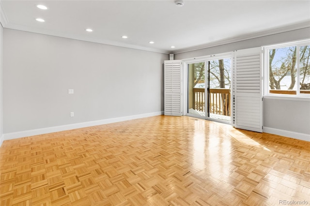 empty room featuring recessed lighting, baseboards, and crown molding