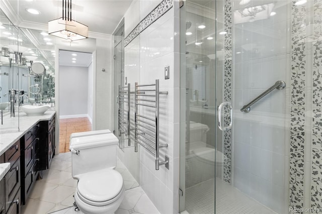 full bathroom with tile patterned flooring, a shower stall, toilet, ornamental molding, and vanity