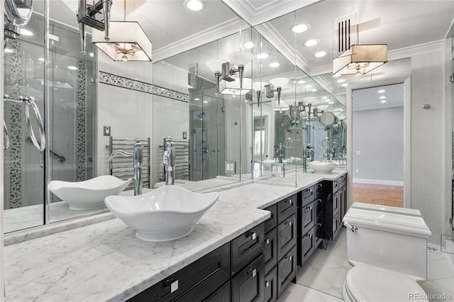 bathroom featuring a sink, a shower stall, ornamental molding, and double vanity