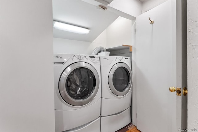 laundry area featuring washer and dryer and laundry area