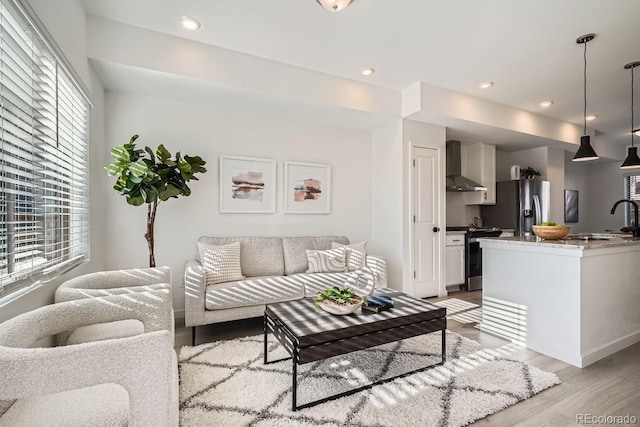 15325 W 69th Dr, Arvada, CO 80007 - living area featuring light wood-type flooring and recessed lighting