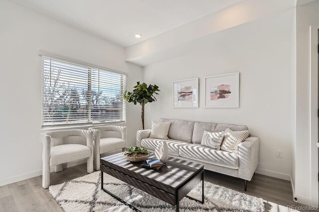 15325 W 69th Dr, Arvada, CO 80007 - living room featuring baseboards, light wood-type flooring, and recessed lighting