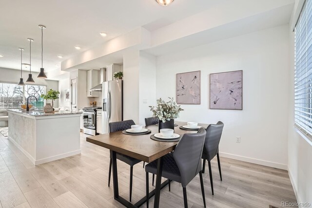 15325 W 69th Dr, Arvada, CO 80007 - dining area featuring light wood-type flooring, plenty of natural light, baseboards, and recessed lighting