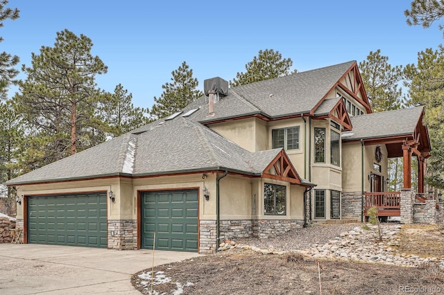 view of front of property featuring stucco siding, stone siding, roof with shingles, concrete driveway, and an attached garage