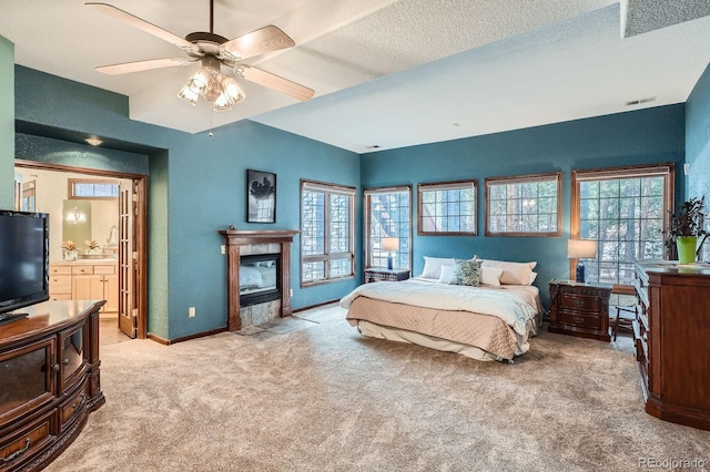 bedroom featuring visible vents, multiple windows, light colored carpet, and baseboards