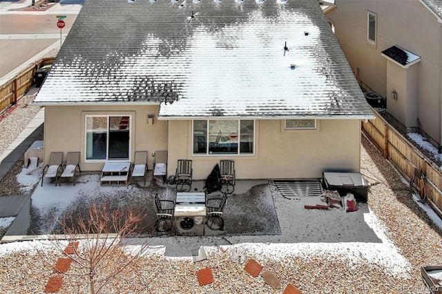 2734 Grand Prix Ct, Colorado Springs, CO 80922 - rear view of property featuring stucco siding, a patio, a fenced backyard, and roof with shingles