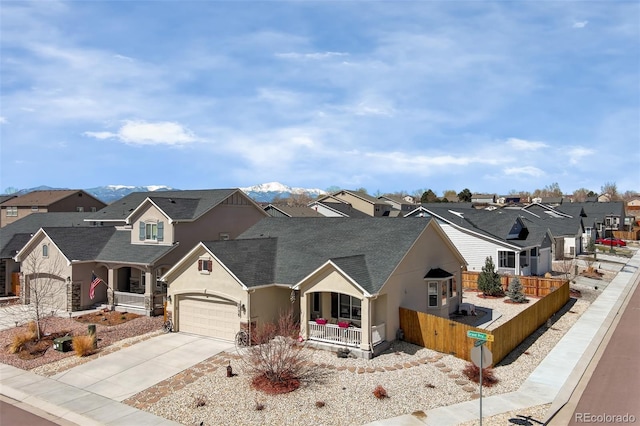 2734 Grand Prix Ct, Colorado Springs, CO 80922 - view of front of home with a porch, stucco siding, a residential view, and fence