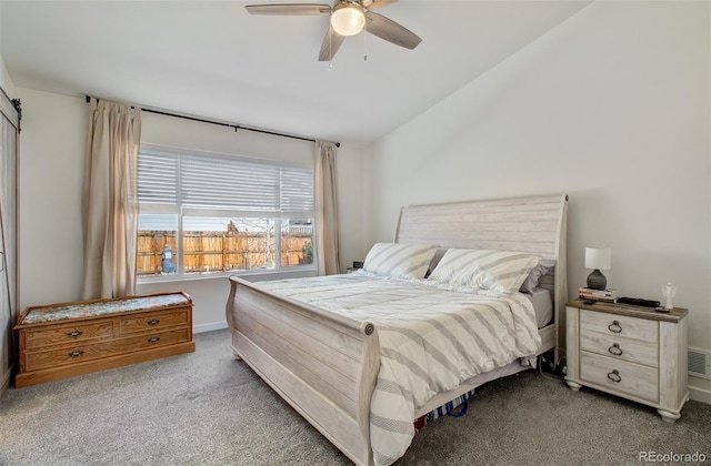 2734 Grand Prix Ct, Colorado Springs, CO 80922 - carpeted bedroom featuring vaulted ceiling, a ceiling fan, and baseboards