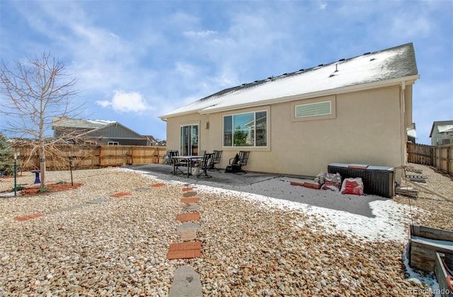 2734 Grand Prix Ct, Colorado Springs, CO 80922 - rear view of property featuring a fenced backyard, a patio area, and stucco siding