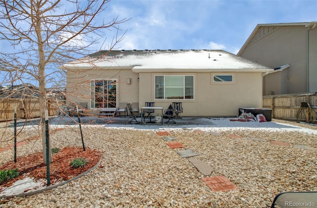 2734 Grand Prix Ct, Colorado Springs, CO 80922 - back of house with stucco siding, a fenced backyard, and a patio
