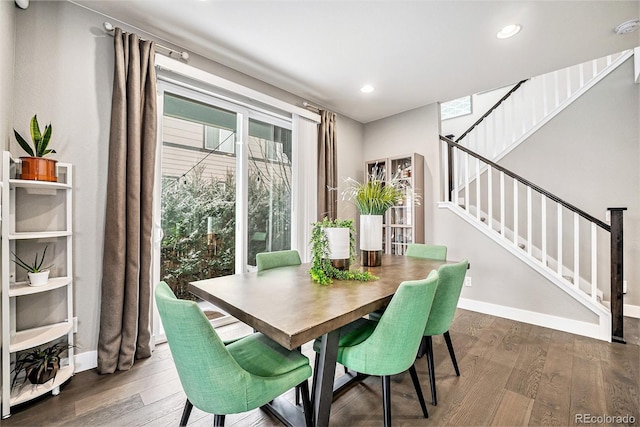 dining space featuring baseboards, stairway, dark wood-style flooring, and recessed lighting