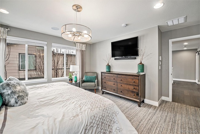 bedroom with an inviting chandelier, recessed lighting, visible vents, and baseboards