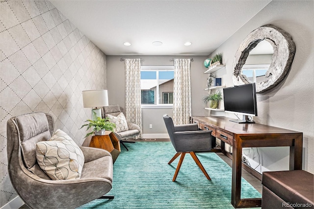 office featuring an accent wall, recessed lighting, wood finished floors, and baseboards